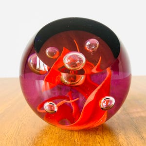 A limited edition Caithness paperweight number 294 of 750. This stylish art glass is signed and numbered