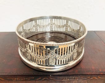 vintage silver plated bottle coaster, made by Alpha Winers of Sheffield, United Kingdom, C 1930