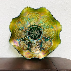 Stunning Fenton hand made carnival glass peacock and grape green iridescent bowl. It was made Circa 1929