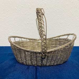 Vintage woven wire silver plated basket with a movable handle