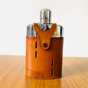 Vintage British made, real hide hip flask, in good vintage condition, stamped on the bottom