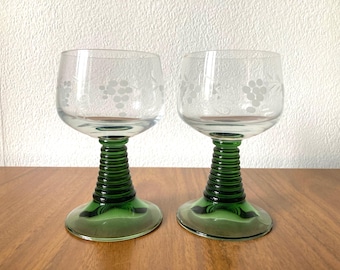 A pair of stylish vintage Roemer wine glasses with green stem, etched with grape design. They are in excellent vintage condition
