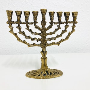 Vintage brass Hanukkah 7 branch menorah, signed on the bottom “RD”