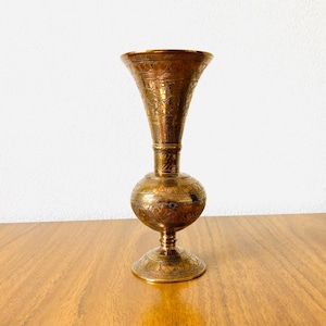 Vintage etched brass Indian vase with floral patterns