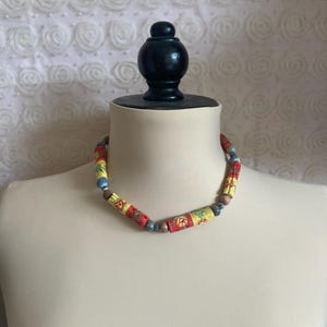 Choker necklace, fabric and beads.