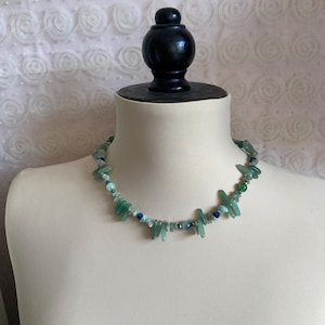 Green choker necklace.