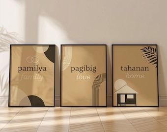 May include: Three framed prints with abstract designs and text in English and Tagalog. The first print is beige with black and white circles and the text "pamilya family". The second print is beige with black and white lines and the text "pagibig love". The third print is beige with a black palm leaf and the text "tahanan home".