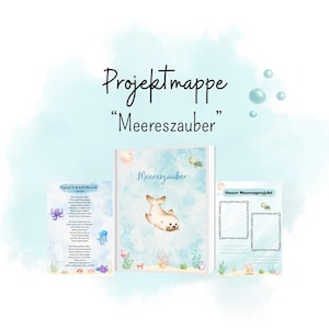 May include: A project folder titled "Projektmappe Meereszauber" featuring a central seal illustration, light blue watercolor background, and two accompanying printed sheets with sea creature graphics and text for a marine-themed educational project.