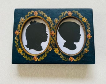 FRAMED - Two Custom Silhouettes in a tiny 3x4 1/2” Vintage Hand Painted Wood Frame, Navy Blue with Flowers (frame NOT sold separately)