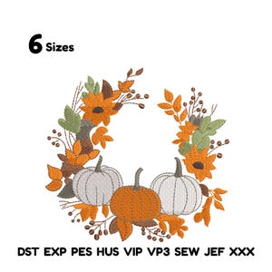 May include: An embroidered wreath design featuring two white pumpkins and one orange pumpkin, surrounded by orange and yellow fall foliage. The text "6 Sizes" is at the top left. The bottom text includes "DST EXP PES HUS VIP VP3 SEW JEF XXX".