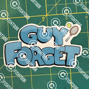 May include: A blue and white sticker with the text "GUY FORGET" in a cartoon font. A tennis racket and a tennis ball are to the right of the text.
