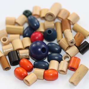 May include: A collection of wooden beads in various colors, including blue, red, orange, and natural wood. The beads are round, oval, and cylindrical in shape.
