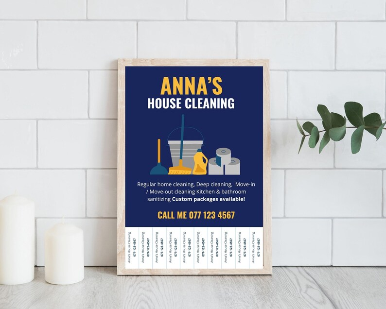 May include: A framed print with a navy blue background and the text "ANNA'S HOUSE CLEANING" in yellow. The image includes cleaning supplies and the phone number 077 123 4567. Services include regular, deep, and move-out cleaning.