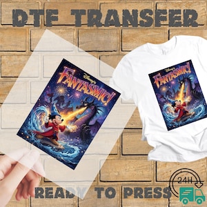 May include: A DTF transfer sheet and a white t-shirt featuring the Disney Fantasmic graphic. The design shows Mickey Mouse in a blue wizard hat and red robe casting magic at a large purple dragon amidst water and fireworks. Text reads Disney's FANTASMIC!
