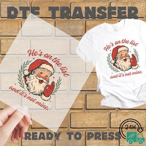 May include: A white t-shirt with a Santa Claus graphic and the text "He's on the list and it's not mine." A clear DTF transfer with the same design is also visible. The words "READY TO PRESS" are at the bottom.