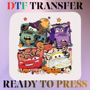 May include: A DTF TRANSFER READY TO PRESS graphic featuring four cartoon cars in Halloween costumes. A green truck as a witch, a purple truck as a vampire, a red car with devil horns, and a yellow car wrapped like a mummy, surrounded by pumpkins.