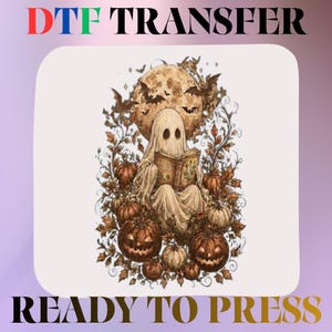 May include: A DTF transfer ready to press featuring a central illustration of a ghost reading a book, surrounded by orange pumpkins, autumn leaves, and bats against a large full moon. The text DTF TRANSFER and READY TO PRESS is visible.