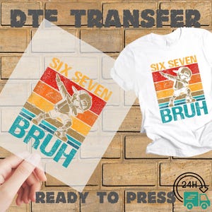 May include: A white t-shirt with a graphic of a baseball player dabbing, with the words "SIX SEVEN BRUH" in orange, red, and teal. A clear transfer sheet with the same design is held in front of the shirt. The words "READY TO PRESS" are at the bottom.