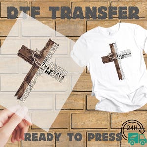 May include: White t-shirt with a graphic of a wooden cross and the text "For God so loved the world that He gave His only Son." A clear DTE transfer is shown next to the shirt. The words "DTE TRANSFER" and "READY TO PRESS" are also visible.