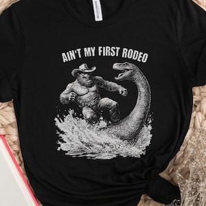 Cowboy Bigfoot T-Shirt, Western Loch Ness Monster Graphic Tee, Vintage Bigfoot Design Shirt, Funny Sasquatch Nessie Mythical Creature Gift