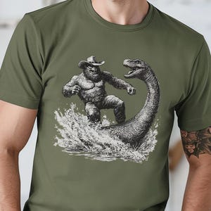 Bigfoot Loch Ness T-Shirt, Weirdcore Cryptid Design, Vintage Western Nessie Graphic Tee, Funny Sasquatch Shirt, Legendary Cowboy Bigfoot Tee