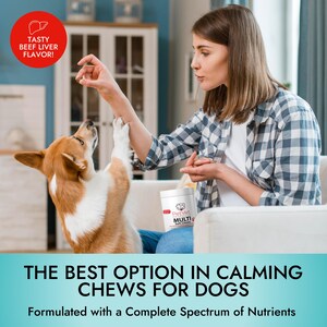 May include: A woman gives a dog a treat. The dog is standing on its hind legs and has its front paws up in the air. The woman is holding a container of PetVet Multi Soft Chews. The text on the container reads "PetVet Multi Soft Chews". The text on the image reads "The Best Option in Calming Chews for Dogs. Formulated with a Complete Spectrum of Nutrients."
