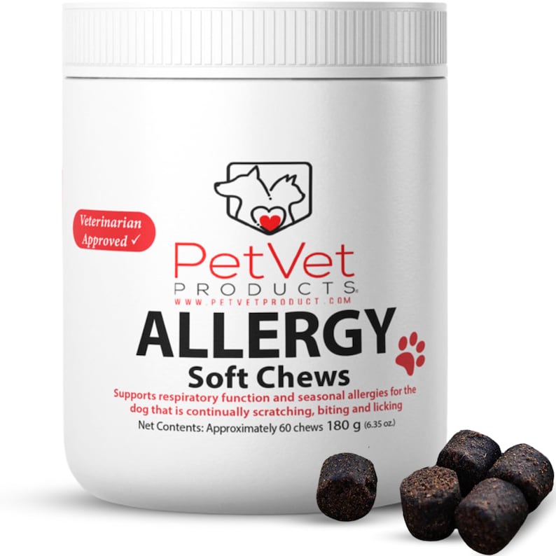 May include: White container of PetVet Allergy Soft Chews for dogs. The container has a red heart logo with a dog and cat silhouette. The label says "Veterinarian Approved" and "Net Contents: Approximately 60 chews 180 g (6.35 oz)". There are several dark brown soft chews scattered around the container.