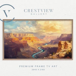 May include: A framed landscape painting of the Grand Canyon. The artwork depicts the canyon's layered rock formations in shades of orange, red, and brown, with a blue river winding through the canyon. The sky is a mix of blue and yellow.