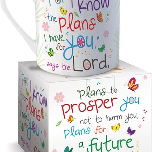 May include: A white ceramic mug and matching square box featuring colorful butterflies, small flowers, and the text: For I know the plans I have for you, says the Lord, plans to prosper you, not to harm you, plans for a future filled with hope.
