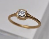 0.50 carat tapered cushion diamond solitaire engagement ring | 18k gold