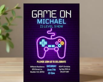 May include: A neon purple and blue video game controller graphic with the text "GAME ON MICHAEL IS LEVEL 9 NOW" on a black brick background. The invitation includes the text "PLEASE JOIN US TO CELEBRATE" and details for a birthday party.