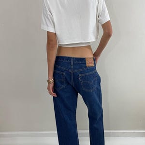Vintage 80s Levi&#39;s 501 medium wash button fly iconic red tab LEVIS jeans made in USA size 32 x 25