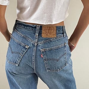 80s vintage faded Levi&#39;s 501 button fly shrink to fit medium wash Levis jeans size 27 x 31