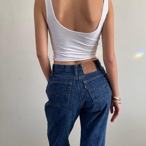 vintage 80s Levi&#39;s 501 dark wash shrink to fit button fly iconic Levis jeans made in USA | size 27 x 32