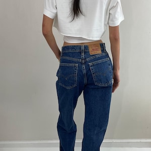 vintage 80s Levi&#39;s 551 high waisted zipper fly medium wash relaxed tall Levis jeans for women made in USA size 29 x 33