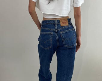 Vintage 80-tals Levi's 551 Jeans: Hög midja, avslappnad passform, tillverkad i USA 29x33