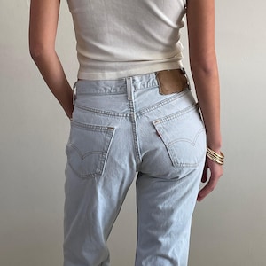 Vintage Levis 501 button fly faded boyfriend light stone wash jeans made in USA size 28 x 28