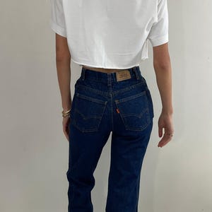 70s Levi&#39;s orange tab bell bottom flare high waisted dark wash Levis womens jeans small petite size 25 x 32