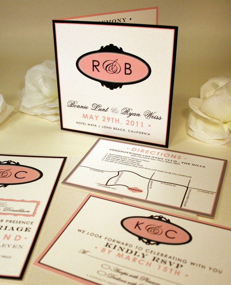 May include: Wedding invitation with black and pink accents. The invitation features the couple's names, wedding date, and location. The invitation also includes a map with directions to the wedding venue.