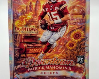 May include: A Patrick Mahomes II rookie card featuring a vibrant illustration. The card showcases the player in a Chiefs uniform, holding a football, with a cityscape and BBQ scene in the background. The card has the text "Downtown" and "Chiefs".