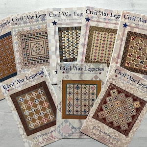 May include: A collection of eight quilting patterns featuring Civil War Legacies quilts for reproduction fabrics. The patterns include "Pearl's Petticoats #2", "Stream", "Thorns and Roses #251", and others.