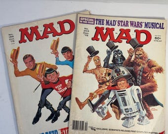 May include: Two vintage MAD magazine covers featuring Star Trek and Star Wars characters. The Star Trek cover features the text "Keep on Trekin'" and the Star Wars cover features the text "The Mad Star Wars Musical".