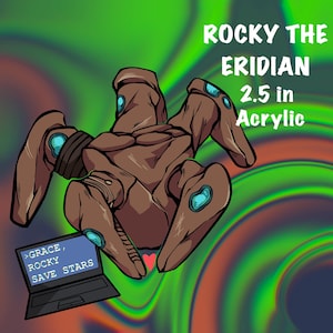 May include: Brown acrylic figure of "Rocky the Eridian," 2.5 inches in size, with blue accents. A small laptop displays the text "Grace, Rocky Save Stars." The background features a swirling pattern of green, blue, and purple.
