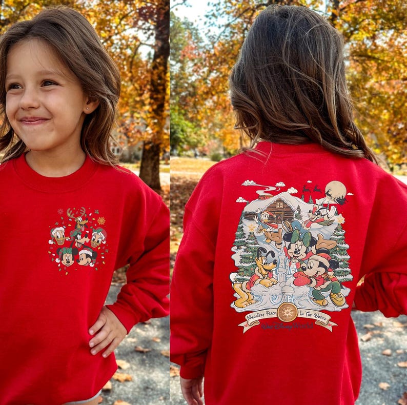 May include: Red sweatshirt with a Christmas-themed Mickey Mouse and friends design on the back. The front of the sweatshirt has a smaller design of Mickey Mouse and friends.