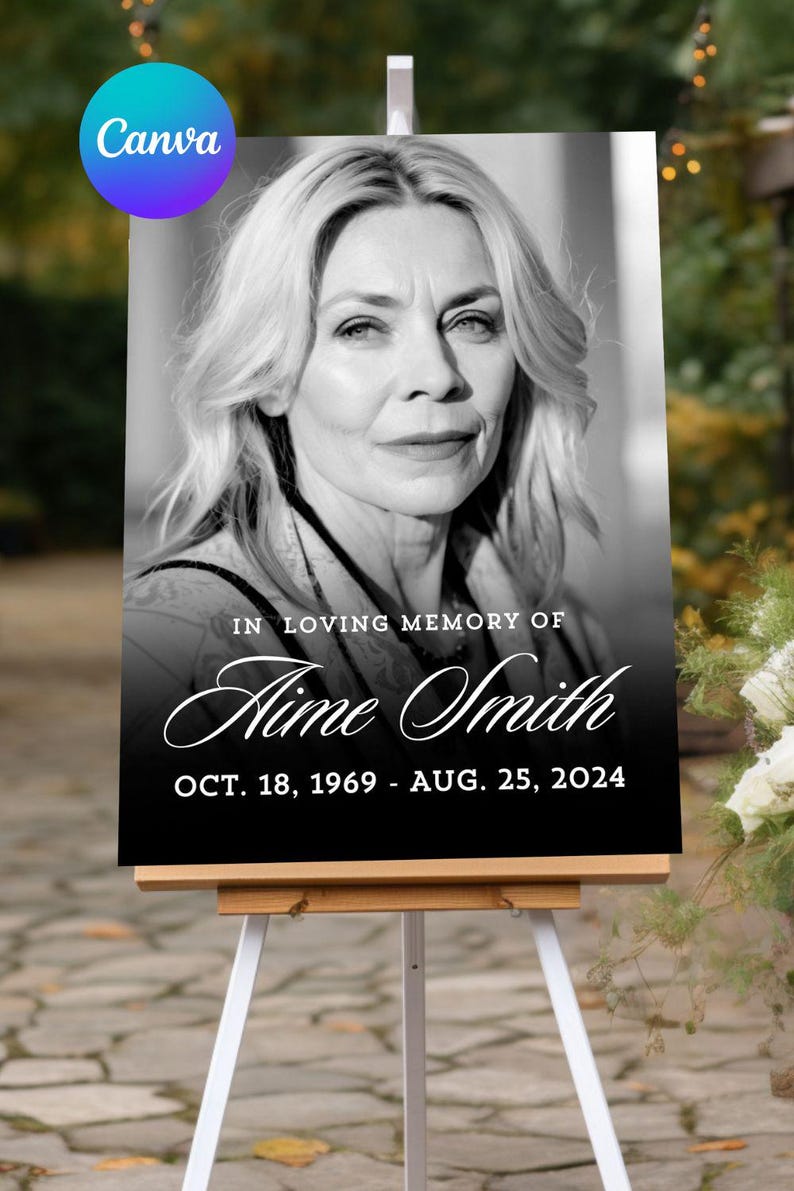 May include: A black and white memorial sign on a white easel. The sign features a portrait of a woman and the text "IN LOVING MEMORY OF Aime Smith OCT. 18, 1969 - AUG. 25, 2024". The Canva logo is in the upper left corner.