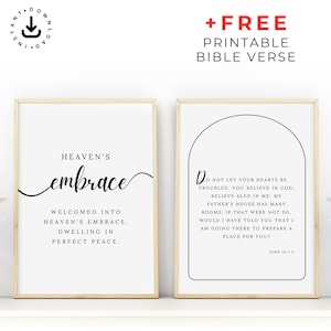May include: Two framed art prints with gold frames. The left print says "Heaven's Embrace" in elegant script. The right print features a Bible verse. Both prints are black text on a white background.