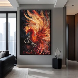 May include: Large framed artwork featuring a vibrant phoenix. The artwork showcases a fiery bird with red, orange, and yellow hues against a dark background. The phoenix has detailed feathers and a decorative chain.