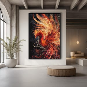 May include: A large framed artwork depicting a phoenix in shades of red, orange, and gold against a dark background. The artwork has a detailed, textured appearance, with the bird's feathers and form intricately rendered. The artwork is displayed in a modern, minimalist interior.