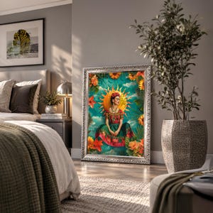 May include: A framed rectangular wall art print featuring a central figure with dark hair and a floral crown, wearing a red and green dress. The figure is surrounded by a bright yellow sun, orange flowers, and green foliage against a teal background.