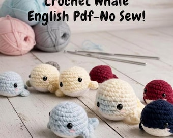 May include: A collection of crocheted whale toys in various colors, including blue, cream, and burgundy. The image also shows balls of yarn in pastel colors and the text "Crochet Whale English Pdf-No Sew!"